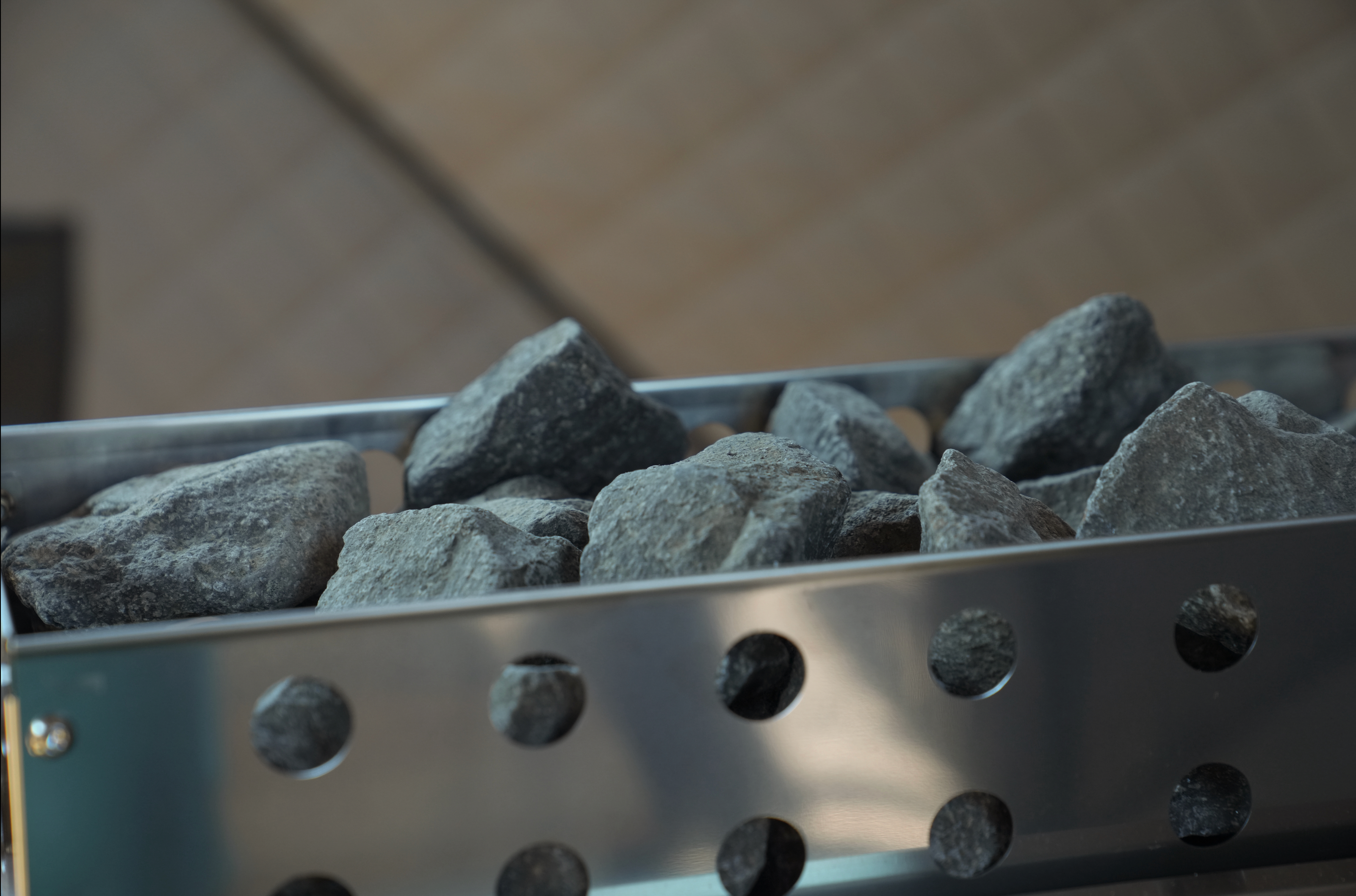 Grill with charcoal briquettes on a blurred background